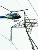 The “flying guardians” of high voltage on a helicopter to monitor the electricity grid